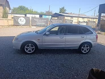 мицубиси колт: Mazda 323: 2003 г., 1.6 л, Автомат, Газ — 2