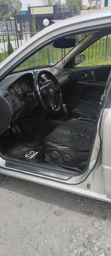 авто мазда: Mazda 323: 2001 г., 1.6 л, Механика, Газ, Универсал — 10