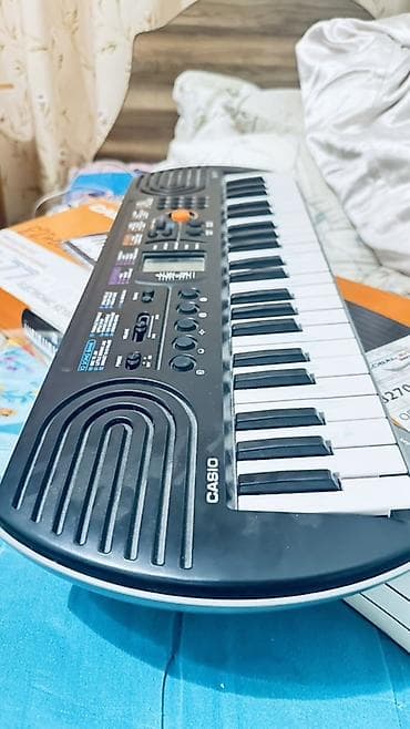 Спорт жана хобби: Синтезатор Casio SA‑77 (мини-клавиши) - 44 мини‑клавиши - Встроенный — 2