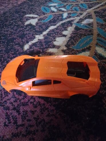 профессиональные музыкальные инструменты: Игрушечная модель автомобиля, оранжевый спортивный купе — 1