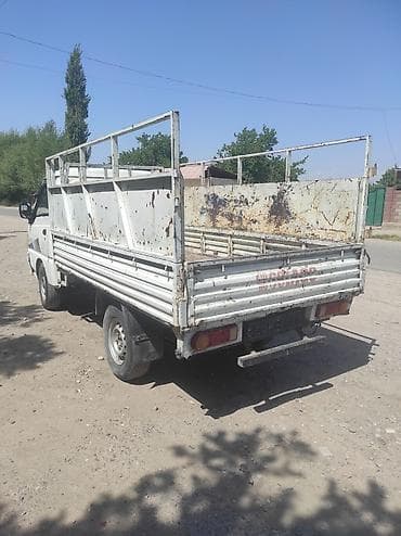 дордой мото: Грузовой малотоннажный бортовой автомобиль (кабина над мотором), белый — 3