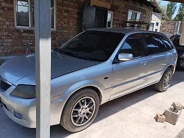люк 124: Mazda 323: 2003 г., Хэтчбэк — 4