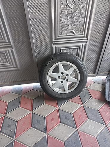 Унаа: Продам 1 Колесо в сборе: легкосплавный диск + шина 205 65 15 - — 1