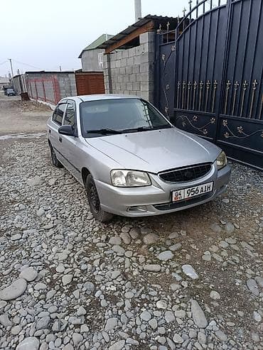 lancer evo: Седан серебристого цвета, компактный и экономичный. Кузов 4‑дверный — 4