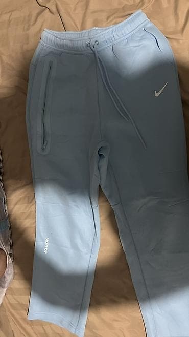 Спортивные брюки Nike NOCTA - Цвет: светло‑голубой (ice blue) - — 1