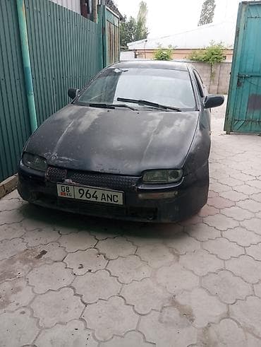 алмашаи: Mazda 323: 1994 г., 1.5 л, Механика, Бензин, Хэтчбэк — 3