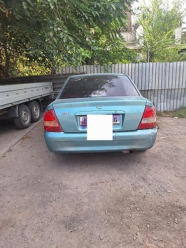 jac 9: Mazda 323: 2001 г., 1.6 л, Механика, Бензин, Седан — 1