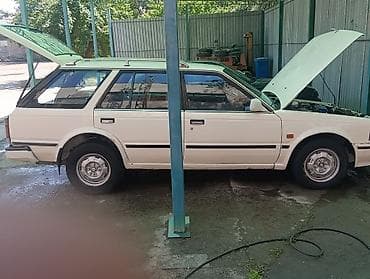 машина byd e2: Nissan Sunny: 1990 г., Бензин, Универсал — 7