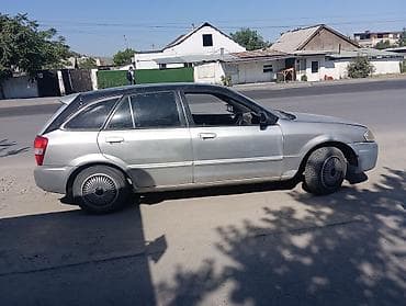 Mazda Familia: 1999 г., 1.5 л, Автомат, Бензин, Универсал — 4