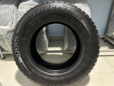 шины на х5: Шины 285 / 60 / R 18, Зимняя шипованная, Б/у, Комплект, Внедорожные (АТ/МТ), США, Bridgestone — 1