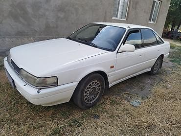 Унаа: Mazda Capella: 1990 г., 2 л, Кол менен иштөөчү, Бензин, Седан — 1