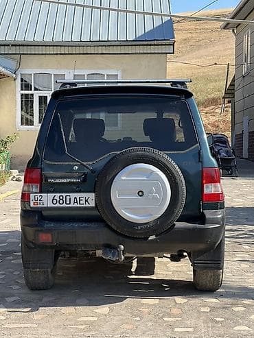 sprinter 315: Mitsubishi Pajero iO: 2004 г., 2 л, Автомат, Бензин, Внедорожник — 7