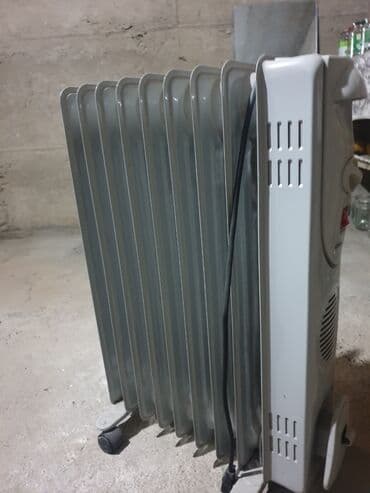 Стационарные телефоны: Масляный обогреватель Кол-во секций: 1, Отключение при перегреве, Быстрый нагрев, Встроенный вентилятор — 1