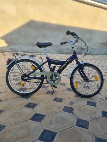 диска семерка: Детский велосипед Topsy синего цвета, оснащенный багажником, передним — 9