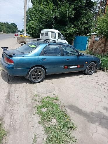 demio бампер: Mazda Cronos: 1993 г., 2 л, Автомат, Бензин, Седан — 5