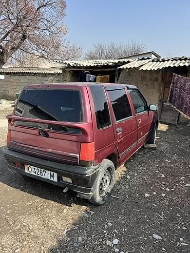 тёпленый масло: Компактный городской хэтчбек, 5 дверей, бордовый цвет. Основные — 4
