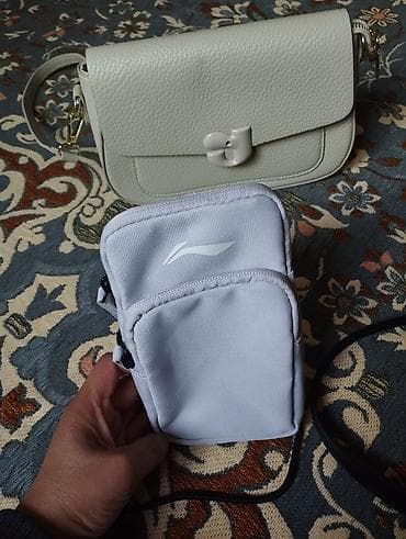Аксессуарлар: Белая сумочка Liningновая,цена 1000с. Черная сумка новая цена — 2