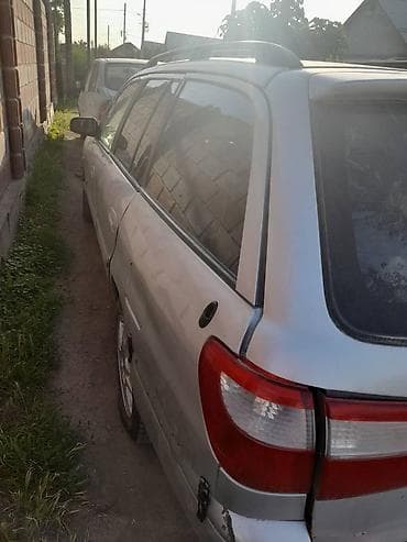 Mazda Familia: 2000 г., Механика, Бензин, Универсал — 1