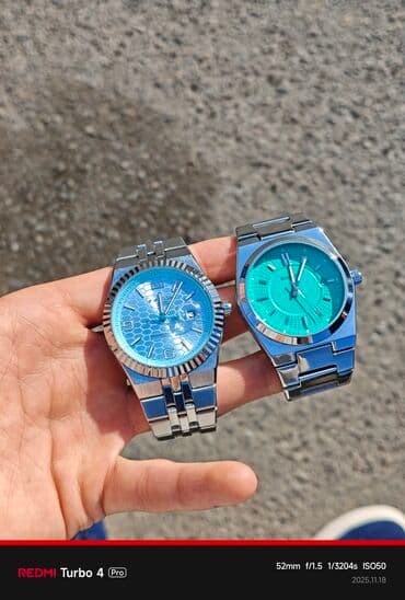 наручные часы оптом: Наручные часы (2 модели) с бирюзово‑голубыми циферблатами и стальными — 1