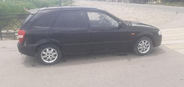 roewe rx5: Mazda 323: 2000 г., 1.8 л, Механика, Бензин, Универсал — 4