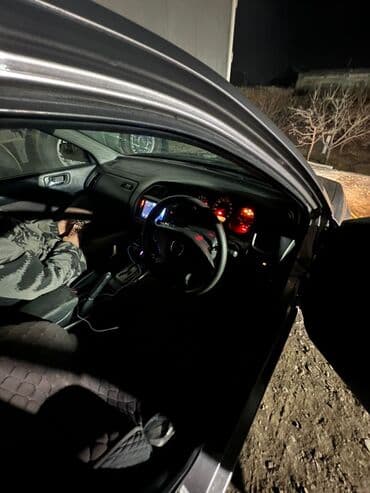 купить двигатель на нексию в бишкеке: Седан серебристого цвета с аэродинамическим спойлером на крышке — 4