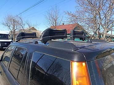 Багажники на крышу и фаркопы: Крепление для лыж и сноубордов На поперечные дуги — 4