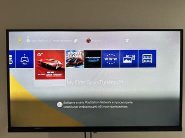 купить джойстик для телевизора: PlayStation 4 (PS4) с двумя беспроводными геймпадами DualShock 4 — 4