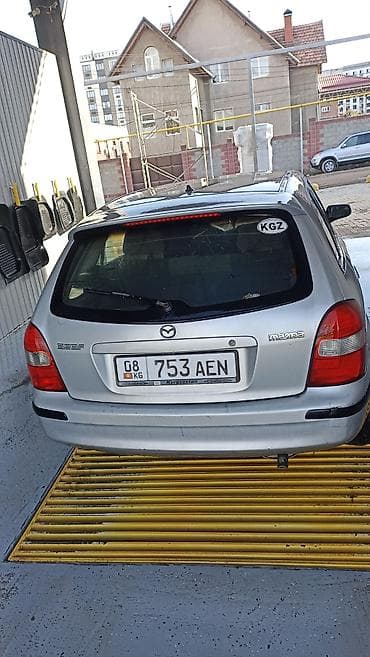 bmb 34: Mazda 323: 2000 г., Механика, Универсал — 1