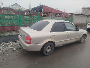Транспорт: Mazda 323: 2001 г., 1.6 л, Кол менен иштөөчү, Бензин, Седан — 3