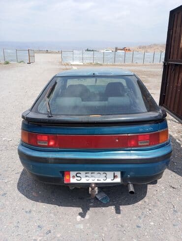 кузов на мазда демио: Автомобиль Mazda 323F (BA) бирюзового цвета, представленный в кузове — 2
