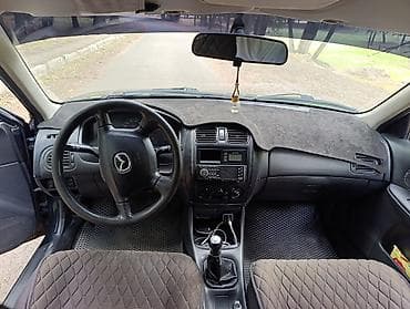 e2 byd: Mazda 323: 2000 г., 1.5 л, Механика, Бензин, Универсал — 1