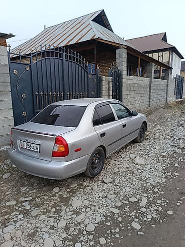 lancer evo: Седан серебристого цвета, компактный и экономичный. Кузов 4‑дверный — 2