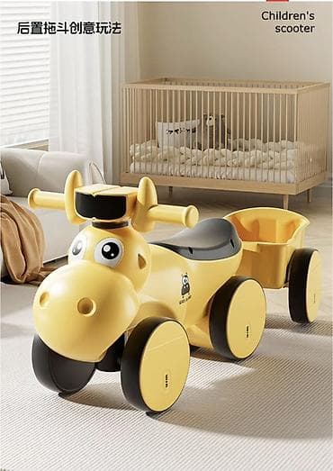 Детский катальный толокар-самокат в виде веселого жирафа. - Формат