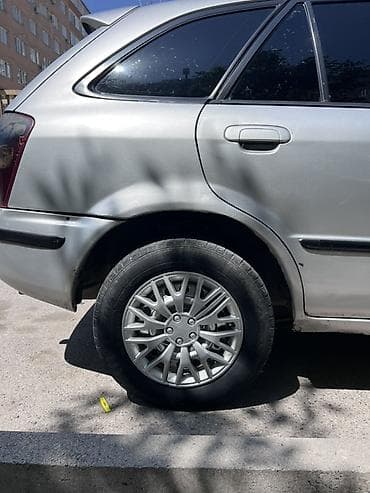 сузики вагон: Mazda 323: 2000 г., 1.6 л, Механика, Бензин, Универсал — 6