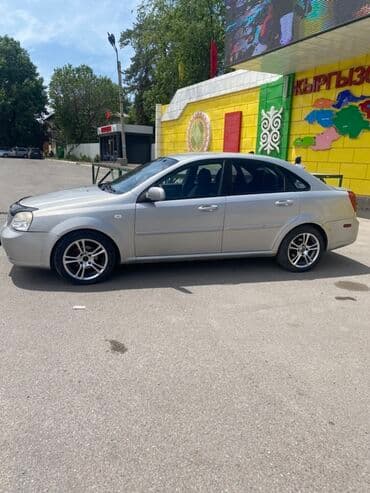 чекол машина: Suzuki Forenza: 2009 г., 2 л, Автомат, Бензин, Седан — 5