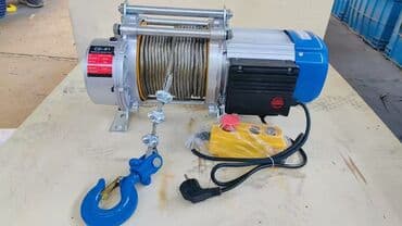 подъёмник на сто: Электрическая лебедка с красным корпусом и серым двигателем — 4