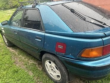 даф 2011: Mazda 323: 1994 г., 1.3 л, Механика, Бензин, Хэтчбэк — 2