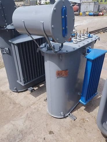 тмг: Силовой трансформатор серого цвета с расширительным баком и — 1