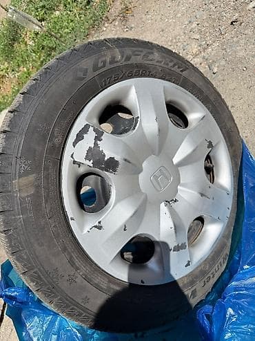 Зимние шины Goform Winter на штампованных дисках с колпаками Honda. - — 4