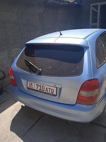 мтз 1021: Mazda 323: 2002 г., 1.6 л, Механика, Бензин, Хэтчбэк — 2