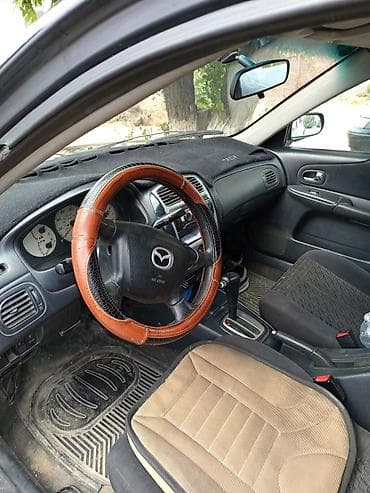 мазда крыло: Mazda Familia: 2001 г., Бензин, Седан — 7