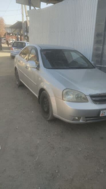 дом на калеса: Шевролет Лачетти Седан светло‑серебристого цвета. Основные — 7