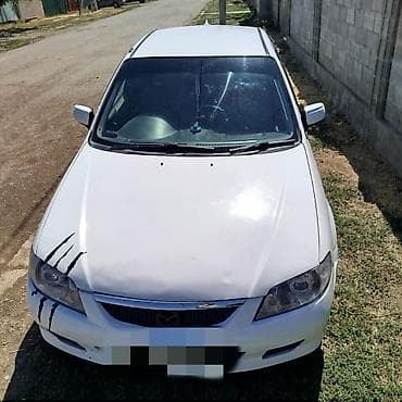 gac gs3: Mazda Familia: 2001 г., 1.3 л, Автомат, Бензин, Седан — 4