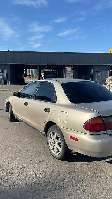 каропка автомат: Mazda 323: 1999 г., 1.5 л, Автомат, Газ, Седан — 2