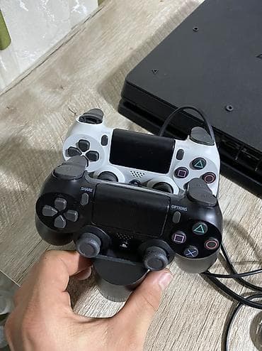 цена на плейстейшен 4: Sony PlayStation 4 Slim (PS4) — версия на 1 ТБ, цвет Jet Black (HDR) — 4