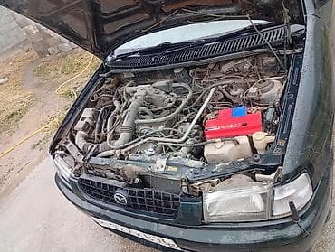митсубиси спейк стар: Mazda Demio: 1997 г., 1.3 л, Автомат, Бензин — 9