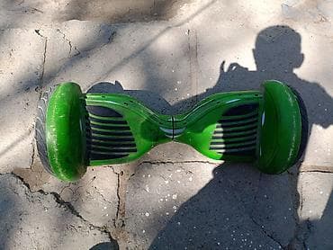 гироскутер батарейка: Гироскутер в ярком зеленом цвете. Оснащен двумя колесами с резиновыми — 2