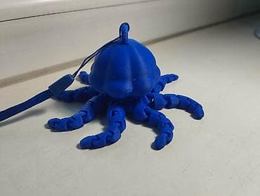 3D‑печатная игрушка‑брелок «Осьминог» из синего пластика. Описание: -