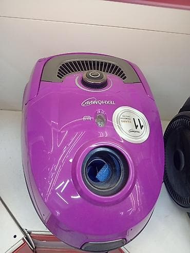 советский пылесос: Пылесос Tехномир (мешковый), компактный корпус фиолетового цвета. - — 1