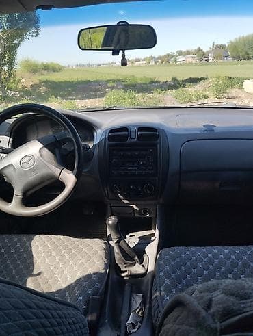 Продажа авто: Mazda 323: 1999 г., 1.6 л, Механика, Бензин, Седан — 5